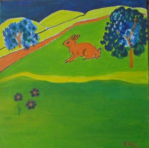 Conejo naranja en un prado verde
