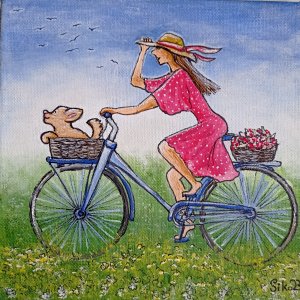 Dívka s pejskem na kole