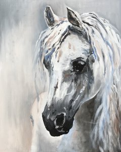 Un cheval blanc.