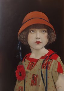 A little girl with a hat and a poppy.
