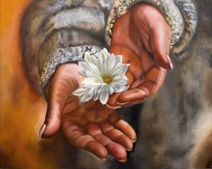 White flower in the palm of the hand